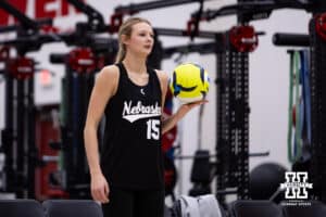 Nebraska Cornhusker Gabby DiVita (15) ready to serve the ball against the Ottawa Braves during a college beach volleyball match on Monday, Feb. 23, 2026, in Lincoln, NE. Photo by John S. Peterson.