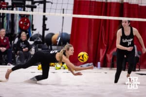 Nebraska Cornhusker Gabby DiVita (15) dives for the ball against the Ottawa Braves during a college beach volleyball match on Monday, Feb. 23, 2026, in Lincoln, NE. Photo by John S. Peterson.