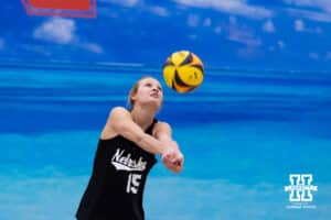 Nebraska Cornhusker Gabby DiVita (15) digs the ball against the Ottawa Braves during a college beach volleyball match on Monday, Feb. 23, 2026, in Lincoln, NE. Photo by John S. Peterson.