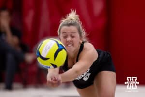 Nebraska Cornhusker Keri Leimbach (6) dives for the dig against the Ottawa Braves during a college beach volleyball match on Monday, Feb. 23, 2026, in Lincoln, NE. Photo by John S. Peterson.
