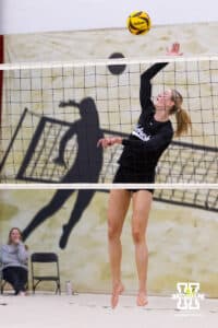 Nebraska Cornhusker Andi Jackson (3) spikes the ball against the Ottawa Braves during a college beach volleyball match on Monday, Feb. 23, 2026, in Lincoln, NE. Photo by John S. Peterson.