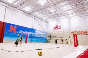 The Ottawa Braves works to return the ball against Nebraska Cornhuskers Laney Choboy (9) and Skyler Pierce (7) during a college beach volleyball match on Monday, Feb. 23, 2026, in Lincoln, NE. Photo by John S. Peterson.