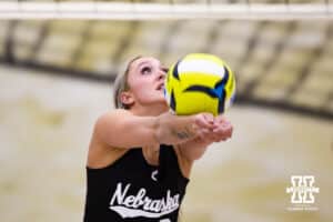 Nebraska Cornhusker Laney Choboy (9) digs the ball against the Ottawa Braves during a college beach volleyball match on Monday, Feb. 23, 2026, in Lincoln, NE. Photo by John S. Peterson.