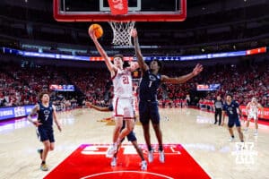 Nebraska Cornhusker forward Pryce Sandfort (21) makes a lay up against Penn State Nittany Lion forward Mason Blackwood (1) in the second half during a college basketball game on Saturday, Feb. 21, 2026, in Lincoln, NE. Photo by John S. Peterson.