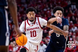 Nebraska Cornhusker guard Jamarques Lawrence (10) drives the lane against Penn State Nittany Lion guard Freddie Dilione V. (5) in the second half during a college basketball game on Saturday, Feb. 21, 2026, in Lincoln, NE. Photo by John S. Peterson.