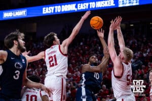 Nebraska Cornhusker forward Pryce Sandfort (21) blocks a shot from Penn State Nittany Lion forward Josh Reed (10) in the first half during a college basketball game on Saturday, Feb. 21, 2026, in Lincoln, NE. Photo by John S. Peterson.