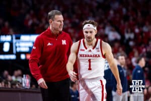 Nebraska Cornhusker head coach Fred Hoiberg talks to Sam Hoiberg coming off the court against the Penn State Nittany Lions in the first half during a college basketball game on Saturday, Feb. 21, 2026, in Lincoln, NE. Photo by John S. Peterson.