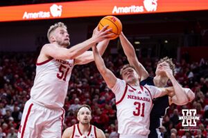 Nebraska Cornhusker forward Rienk Mast (51) and guard Cale Jacobsen (31) reach for a rebound against the Penn State Nittany Lions in the first half during a college basketball game on Saturday, Feb. 21, 2026, in Lincoln, NE. Photo by John S. Peterson.