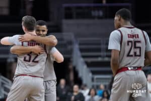 Omaha Mavericks Tony Osburn (32) and Grant Stubblefield (3) hug during a college basketball game against Oral Roberts on Feb 18, 2026, in Omaha, Nebraska. Photo by Brandon Tiedemann