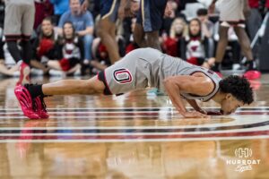 Omaha Mavericks Lance Waddles (7) kisses the logo during a college basketball game against Oral Roberts on Feb 18, 2026, in Omaha, Nebraska. Photo by Brandon Tiedemann