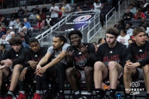 Omaha Mavericks Ja'Sean Glover (5) smiles on the bench during a college basketball game against Oral Roberts on Feb 18, 2026, in Omaha, Nebraska. Photo by Brandon Tiedemann