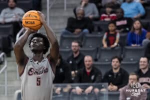 Omaha Mavericks Ja'Sean Glover (5) shoots a three during a college basketball game against Oral Roberts on Feb 18, 2026, in Omaha, Nebraska. Photo by Brandon Tiedemann