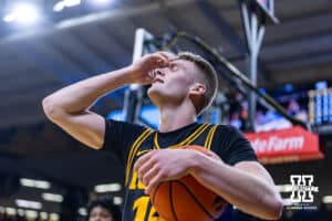 Iowa Hawkeye guard Bennett Stirtz (14) reacts to a foul called against him guarding Nebraska Cornhusker forward Pryce Sandfort (21) in the second half during a college basketball game on Tuesday, Feb. 17, 2026, in Iowa City, Iowa. Photo by John S. Peterson.