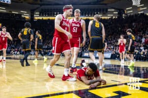Nebraska Cornhusker guard Jamarques Lawrence (10) gets knocked to the floor against the Iowa Hawkeyes in the second half during a college basketball game on Tuesday, Feb. 17, 2026, in Iowa City, Iowa. Photo by John S. Peterson.