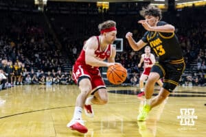Nebraska Cornhusker guard Sam Hoiberg (1) dribbles the ball against Iowa Hawkeye guard Isaia Howard (23) in the second half during a college basketball game on Tuesday, Feb. 17, 2026, in Iowa City, Iowa. Photo by John S. Peterson.
