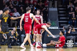Nebraska Cornhusker guard Sam Hoiberg (1) reaches out to help Jamarques Lawrence in the second half against the Iowa Hawkeyes during a college basketball game on Tuesday, Feb. 17, 2026, in Iowa City, Iowa. Photo by John S. Peterson.