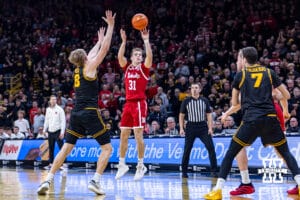 Nebraska Cornhusker guard Cale Jacobsen (31) make a three point basket against the Iowa Hawkeyes in the first half during a college basketball game on Tuesday, Feb. 17, 2026, in Iowa City, Iowa. Photo by John S. Peterson.