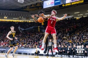 Nebraska Cornhusker guard Sam Hoiberg (1) goes for a rebound against Iowa Hawkeye guard Tavion Banks (6) in the first half during a college basketball game on Tuesday, Feb. 17, 2026, in Iowa City, Iowa. Photo by John S. Peterson.