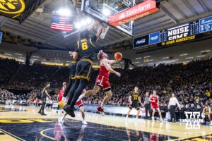 Nebraska Cornhusker guard Sam Hoiberg (1) makes a lay up against the Iowa Hawkeyes in the first half during a college basketball game on Tuesday, Feb. 17, 2026, in Iowa City, Iowa. Photo by John S. Peterson.
