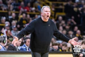 Iowa Hawkeye fan, courtside, reacts to the officials calls against Iowa during a college basketball game against the Nebraska Cornhuskers on Tuesday, Feb. 17, 2026, in Iowa City, Iowa. Photo by John S. Peterson.
