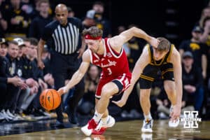 Nebraska Cornhusker guard Sam Hoiberg (1) steals the ball away from Iowa Hawkeye forward Cooper Koch (8) in the first half during a college basketball game on Tuesday, Feb. 17, 2026, in Iowa City, Iowa. Photo by John S. Peterson.