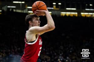 Nebraska Cornhusker forward Pryce Sandfort (21) makes a three point shot against the Iowa Hawkeyes in the first half during a college basketball game on Tuesday, Feb. 17, 2026, in Iowa City, Iowa. Photo by John S. Peterson.