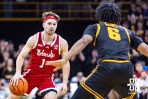 Nebraska Cornhusker guard Sam Hoiberg (1) dribbles the ball against Iowa Hawkeye guard Tavion Banks (6) in the first half during a college basketball game on Tuesday, Feb. 17, 2026, in Iowa City, Iowa. Photo by John S. Peterson.