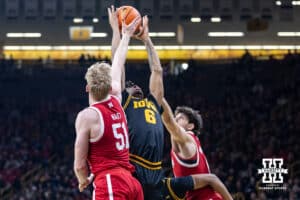 Nebraska Cornhusker forward Rienk Mast (51) reaches for a rebound against Iowa Hawkeye guard Tavion Banks (6) in the first half during a college basketball game on Tuesday, Feb. 17, 2026, in Iowa City, Iowa. Photo by John S. Peterson.