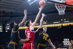 Nebraska Cornhusker forward Pryce Sandfort (21) makes a lay up against the Iowa Hawkeyes in the first half during a college basketball game on Tuesday, Feb. 17, 2026, in Iowa City, Iowa. Photo by John S. Peterson.