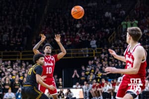 Nebraska Cornhusker guard Jamarques Lawrence (10) makes a pass to Pryce Sandfort against the Iowa Hawkeyes during a college basketball game on Tuesday, Feb. 17, 2026, in Iowa City, Iowa. Photo by John S. Peterson.