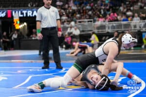 Skutt Catholics Kaylyn Harril flips Lincoln Northeasts Sammara Alfayo during Nebraska Girls Wrestling on Feb 17, 2026, in Omaha, Nebraska. Photo by Brandon Tiedemann