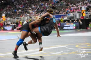 Omaha Westviews Kalynn Lyons drives Kearneys Lauren Schmeits during Nebraska Girls Wrestling Quarterfinals on Feb 17, 2026, in Omaha, Nebraska. Photo by Brandon Tiedemann