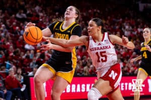 Nebraska Cornhusker guard Kennadi Williams (15) breaks a lay up by Iowa Hawkeye center Ava Heiden (5) in the fourth quarter during a college basketball game on Monday, Feb. 16, 2026, in Lincoln, Nebraska. Photo by John S. Peterson.