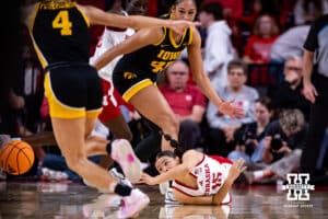 Nebraska Cornhusker guard Kennadi Williams (15) scrambles for the loose ball and make a pass against the Iowa Hawkeyes during a college basketball game on Monday, Feb. 16, 2026, in Lincoln, Nebraska. Photo by John S. Peterson.