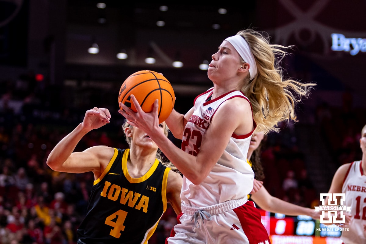 Nebraska WBB v Iowa Feb 16, 2026 | Hail Varsity Nebraska Cornhusker guard Britt Prince (23) drives to the basket against Iowa Hawkeye guard Kylie Feuerbach (4) in the first quarter during a college basketball game on Monday, Feb. 16, 2026, in Lincoln, Nebraska. Photo by John S. Peterson.
