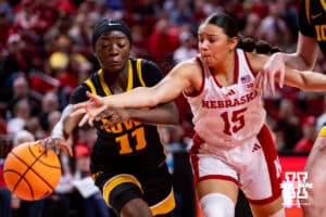 Nebraska Cornhusker guard Kennadi Williams (15) reaches for the ball against Iowa Hawkeye guard Chazadi Wright (11) in the first quarter during a college basketball game on Monday, Feb. 16, 2026, in Lincoln, Nebraska. Photo by John S. Peterson.