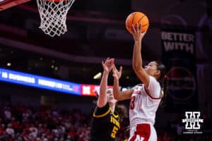 Nebraska Cornhusker forward Amiah Hargrove (33) makes a lay up against Iowa Hawkeye center Ava Heiden (5)in the firds during a college basketball game on Monday, Feb. 16, 2026, in Lincoln, Nebraska. Photo by John S. Peterson.