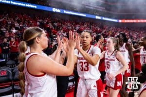Nebraska Cornhusker forward Amiah Hargrove (33) gives guard Logan Nissley (2) high fives before taking on the Iowa Hawkeyes during a college basketball game on Monday, Feb. 16, 2026, in Lincoln, Nebraska. Photo by John S. Peterson.