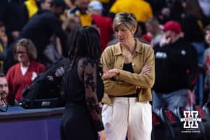 Nebraska Cornhusker head coach Amy Williams meets with Iowa Hawkeye head coach Jan Jensen during a college basketball game on Monday, Feb. 16, 2026, in Lincoln, Nebraska. Photo by John S. Peterson.