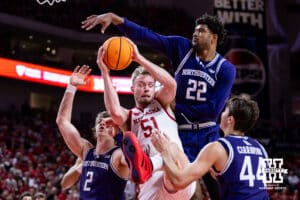 Nebraska Cornhusker forward Rienk Mast (51) grabs the rebound against Northwestern Wildcat forward Nick Martinelli (2), forward Arrinten Page (22), and guard Angelo Ciaravino (44) in the first half during a college basketball game on Saturday, Feb. 14, 2026, in Lincoln, Nebraska. Photo by John S. Peterson.