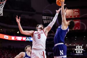Nebraska Cornhusker forward Berke Büyüktuncel (9) reaches for the ball against Northwestern Wildcat forward Tre Singleton (8) in the first half during a college basketball game on Saturday, Feb. 14, 2026, in Lincoln, Nebraska. Photo by John S. Peterson.