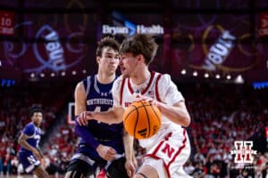 Nebraska Cornhusker forward Braden Frager (5) drives along the baseline against Northwestern Wildcat guard Angelo Ciaravino (44) in the first half during a college basketball game on Saturday, Feb. 14, 2026, in Lincoln, Nebraska. Photo by John S. Peterson.