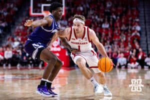 Nebraska Cornhusker guard Sam Hoiberg (1) drives to the basket against Northwestern Wildcat guard Jordan Clayton (11) in the first half during a college basketball game on Saturday, Feb. 14, 2026, in Lincoln, Nebraska. Photo by John S. Peterson.