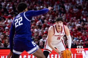 Nebraska Cornhusker forward Berke Büyüktuncel (9) looks for teammate to pass to against Northwestern Wildcat forward Arrinten Page (22) in the first half during a college basketball game on Saturday, Feb. 14, 2026, in Lincoln, Nebraska. Photo by John S. Peterson.
