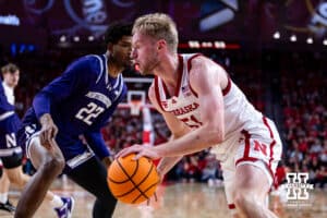 Nebraska Cornhusker forward Rienk Mast (51) drives along the baseline against Northwestern Wildcat forward Arrinten Page (22) in the first half during a college basketball game on Saturday, Feb. 14, 2026, in Lincoln, Nebraska. Photo by John S. Peterson.