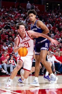 Nebraska Cornhusker forward Pryce Sandfort (21) drives along the baseline against Northwestern Wildcatsin the first half during a college basketball game on Saturday, Feb. 14, 2026, in Lincoln, Nebraska. Photo by John S. Peterson.