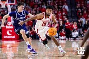 Nebraska Cornhusker guard Jamarques Lawrence (10) dribbles the ball against Northwestern Wildcat forward Nick Martinelli (2) in the first half during a college basketball game on Saturday, Feb. 14, 2026, in Lincoln, Nebraska. Photo by John S. Peterson.