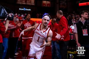Nebraska Cornhusker guard Sam Hoiberg (1) runs out to the court giving five to alumni basketball players to take on the Northwestern Wildcats during a college basketball game on Saturday, Feb. 14, 2026, in Lincoln, Nebraska. Photo by John S. Peterson.