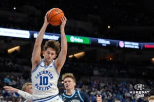 Creighton Bluejay Hudson Greer (10) grabs a rebound during a college basketball game against Villanova on Feb 14, 2026, in Omaha, Nebraska. Photo by Brandon Tiedemann