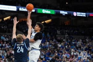Creighton Bluejay Jasen Green (0) shoots over a defender during a college basketball game against Villanova on Feb 14, 2026, in Omaha, Nebraska. Photo by Brandon Tiedemann